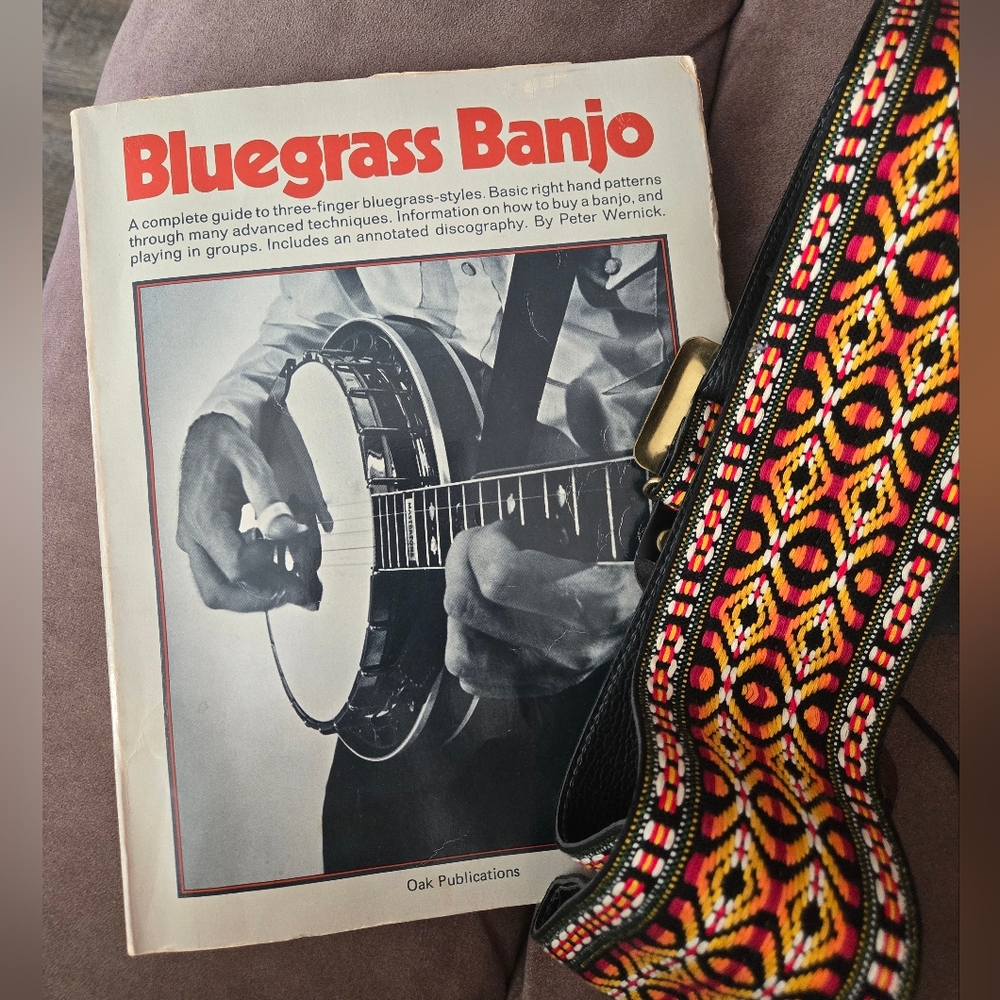 Bluegrass Banjo by Peter Wernick, published by Oak Publications and Guitar Strap